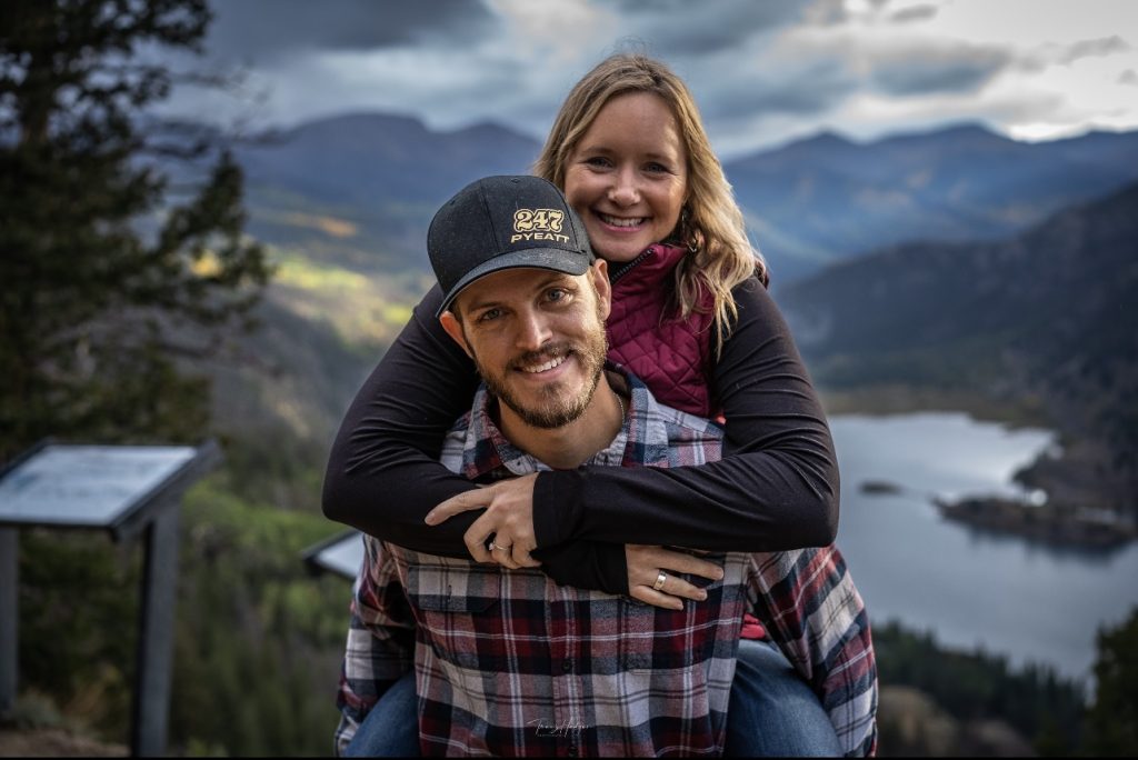 Krystal Murphy stands behind her husband, Mitchell, with an incredible view of the San Juan Mountains behind them.