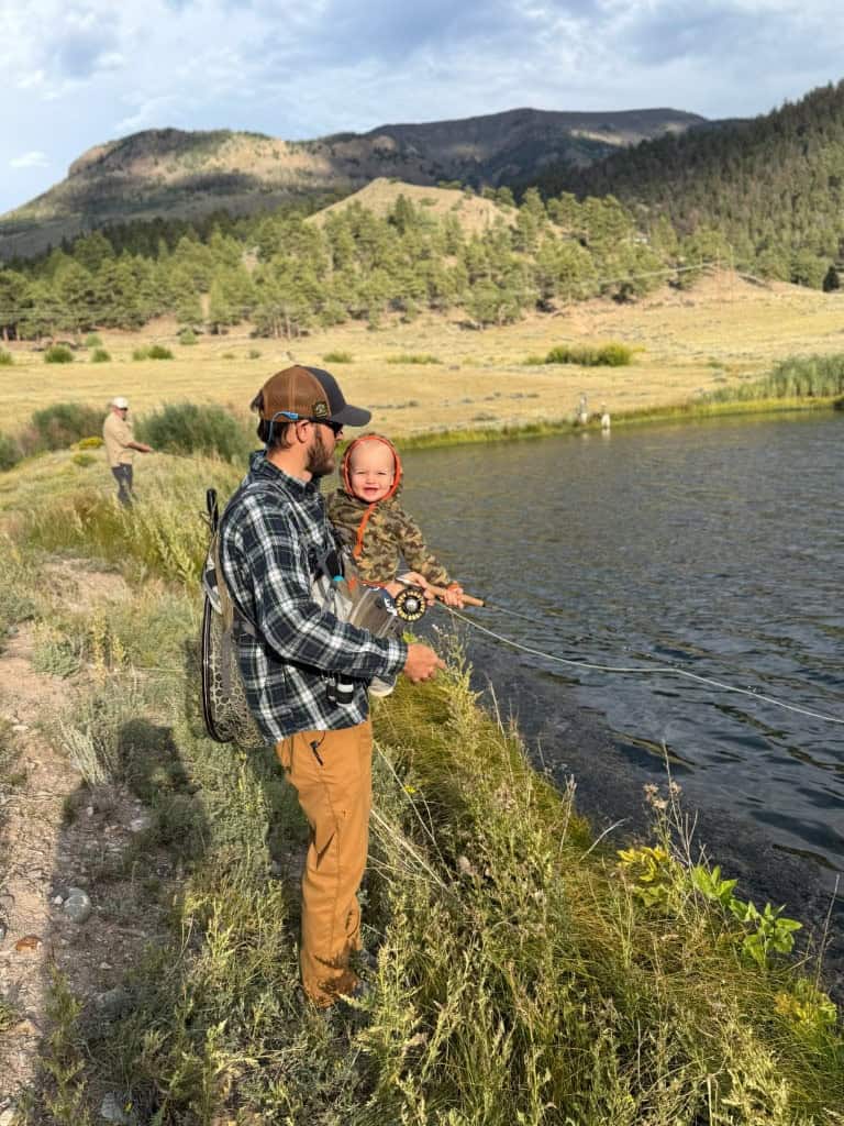 Mitchell and a happy toddler fish lake-side in Lake City, Colorado.